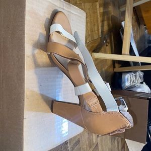 This is a brown and white leather shoe from Audrey Brooke